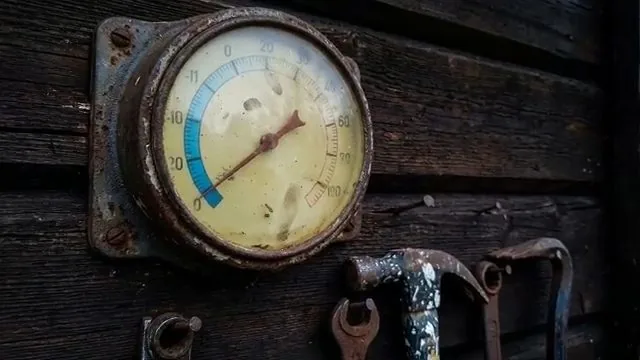 Close up temperature gauge on frozen line, part of everyday plumbing calls around Austell, GA.