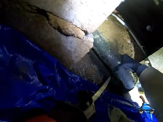 Cutting damaged crawlspace sewer pipe, part of everyday plumbing calls around Austell, GA.