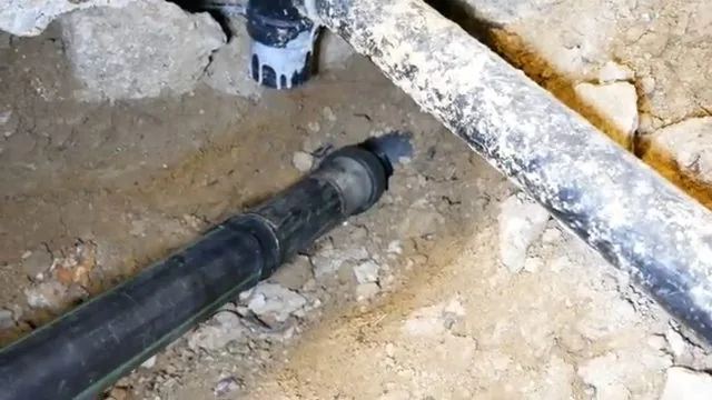 Indoor slab trench for sewer replacement, part of everyday plumbing calls around Austell, GA.